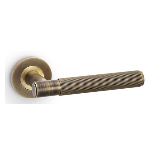 Alexander & Wilks AW222AB Spitfire Reeded Lever On Round Rose - Antique Brass (LEAD TIME: 2-3 DAYS)